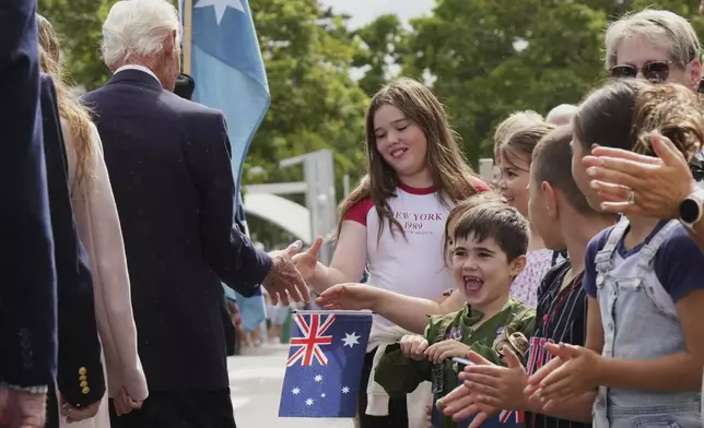Children react as veterans march during the Anzac Day commemorations in Nelson Bay, Australia, Friday, April 25, 2025. (AP Photo/Mark Baker)