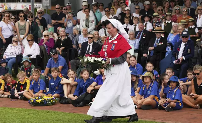 A veteran prepares to lay a wreath during the Anzac Day commemorations in Nelson Bay, Australia, Friday, April 25, 2025. (AP Photo/Mark Baker)