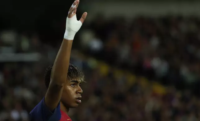 Barcelona's Lamine Yamal gets ready to take a corner kick during a Spanish La Liga soccer match between Barcelona and Mallorca at the Lluis Companys Olympic stadium in Barcelona, Spain, Tuesday, April 22, 2025. (AP Photo/Joan Monfort)