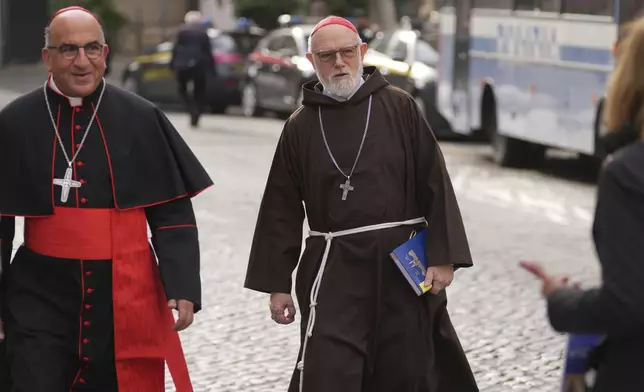 Cardinal Fernando Natalio Chomalí Garib, left, and Cardinal Sean O'Malley, arrive for a college of cardinals' meeting at the Vatican, Thursday, April 24, 2025. (AP Photo/Andrew Medichini)