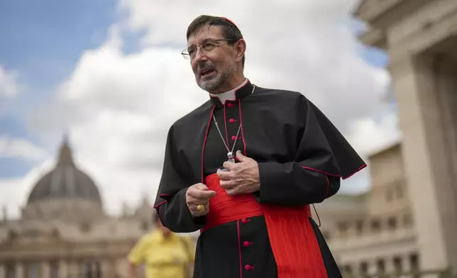 Archbishop of Madrid, Cardinal Jose Cobo Cano walks in St. Peter's Square at the Vatican at the end of a mass on the second of nine days of mourning for late Pope Francis presided over by Vatican Secretary of State, Cardinal Pietro Parolin, Sunday, April 27, 2025. (AP Photo/Francisco Seco)