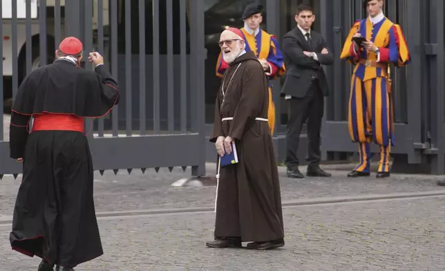Cardinal Sean O'Malley, center, waits for another cardinal as they arrive for a college of cardinals' meeting at the Vatican, Thursday, April 24, 2025. (AP Photo/Andrew Medichini)