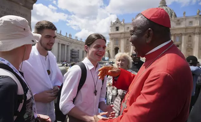 Cardinal John Olorunfemi Onaiyekan, of Nigeria, greets people in St. Peter's Square after the funeral of Pope Francis at the Vatican, Saturday, April 26, 2025. (AP Photo/Andrew Medichini)