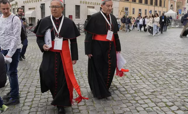 Colombian cardinals Luis José Rueda Aparicio, left, and Rubén Salazar Gómez arrive for a college of cardinals' meeting, at the Vatican, Monday, April 28, 2025. (AP Photo/Gregorio Borgia)