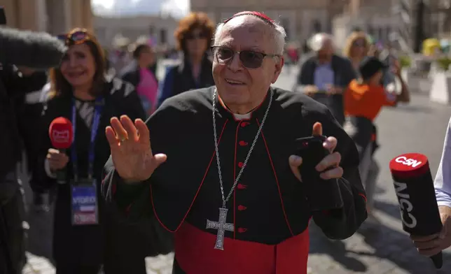 Cardinal Aquilino Bocos walks in St. Peter's Square at the Vatican, Thursday April 24, 2025. (AP Photo/Francisco Seco)