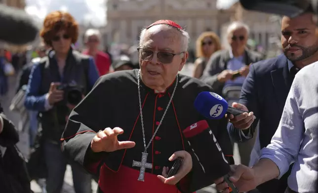 Cardinal Aquilino Bocos walks in St. Peter's Square at the Vatican, Thursday April 24, 2025. (AP Photo/Francisco Seco)