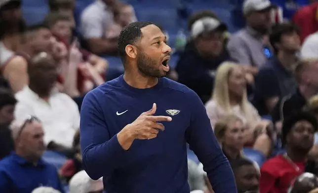 New Orleans Pelicans head coach Willie Green calls out from the bench in the first half of an NBA basketball game against the Oklahoma City Thunder in New Orleans, Sunday, April 13, 2025. (AP Photo/Gerald Herbert)
