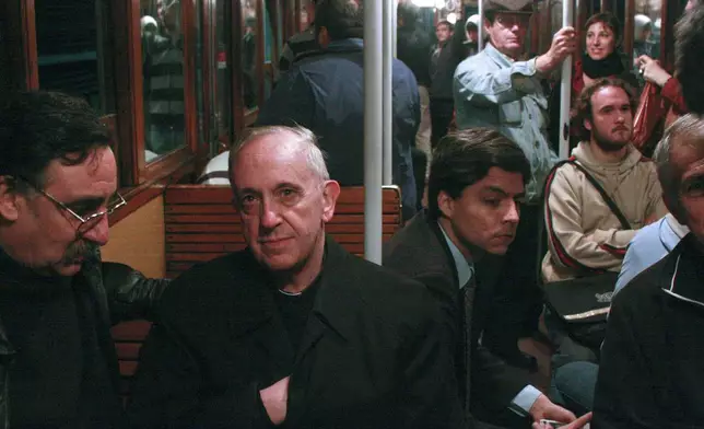 FILE - The then Cardinal Jorge Mario Bergoglio, second left, now Pope Francis, travels on the subway in Buenos Aires, Argentina, in this 2008 file photo. (AP Photo/Pablo Leguizamon, File)