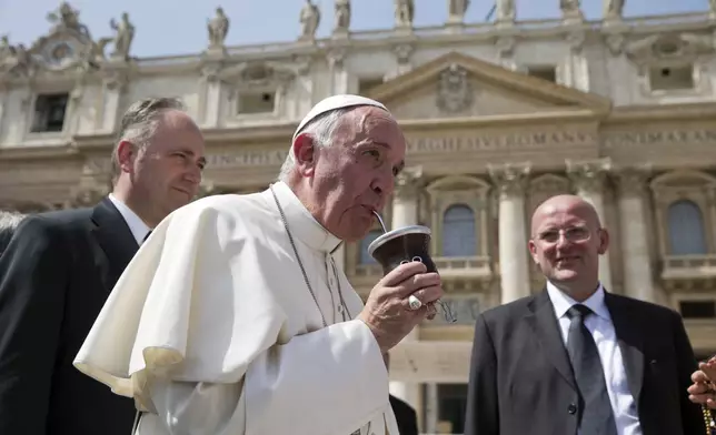 FILE - Pope Francis drinks from a mate gourd at the end of his weekly general audience, in St. Peter's Square at the Vatican, on April 6, 2016. (AP Photo/Andrew Medichini, file)