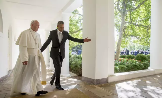 FILE - President Barack Obama and Pope Francis walk down the Colonnade before meeting in the Oval Office of the White House in Washington, Wednesday, Sept. 23, 2015. (AP Photo/Andrew Harnik, file)