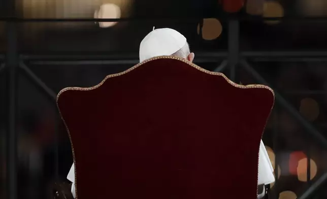 FILE - Pope Francis presides over the Via Crucis (Way of the Cross) torchlight procession on Good Friday, a Christian holiday commemorating the crucifixion of Jesus Christ and his death at Calvary, in front of Rome's Colosseum, in Rome, Friday, April 19, 2019. (AP Photo/Andrew Medichini, file)