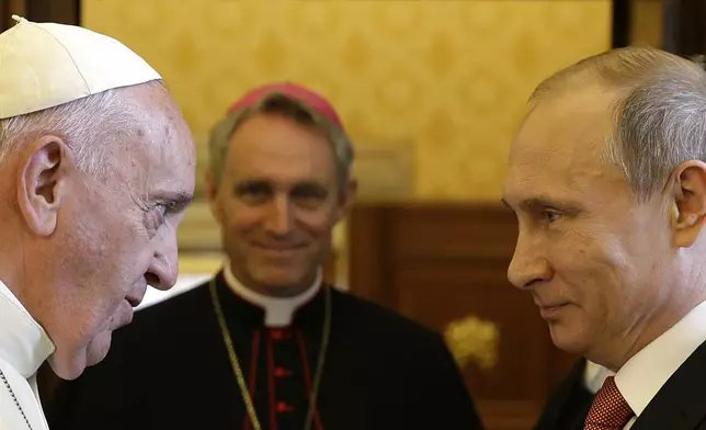 FILE - Pope Francis meets Russian President Vladimir Putin on the occasion of a private audience at the Vatican, June 10, 2015. (AP Photo/Gregorio Borgia, Pool, File)