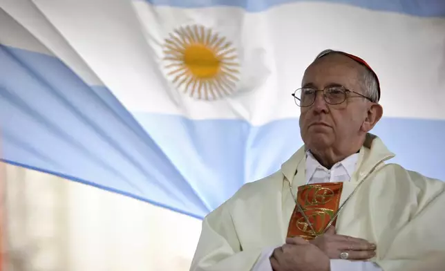 FILE - In this Aug. 7, 2009 file photo, Argentina's Cardinal Jorge Bergoglio gives a Mass outside the San Cayetano church where an Argentine flag hangs behind in Buenos Aires, Argentina. (AP Photo/Natacha Pisarenko, file)