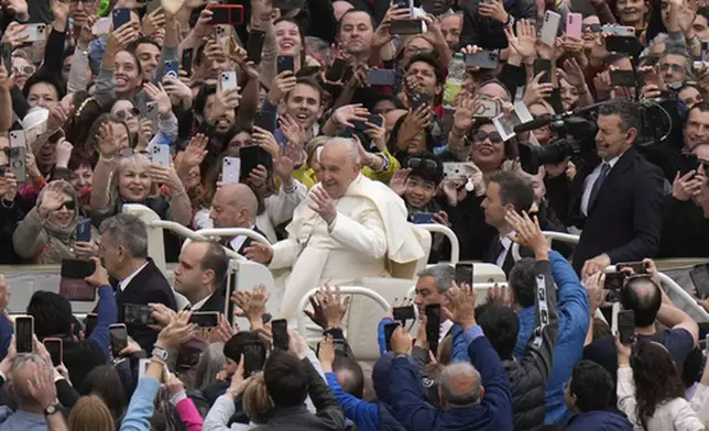 FILE - Pope Francis waves faithful after celebrating Easter mass in St. Peter's Square at the Vatican, Sunday, March 31, 2024. (AP Photo/Alessandra Tarantino, File)