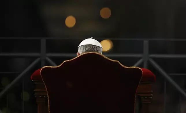 FILE - Pope Francis presides the Via Crucis (Way of the Cross) torchlight procession celebrated in front of the Colosseum on Good Friday in Rome, Friday, March 29, 2013. (AP Photo/Andrew Medichini, File)
