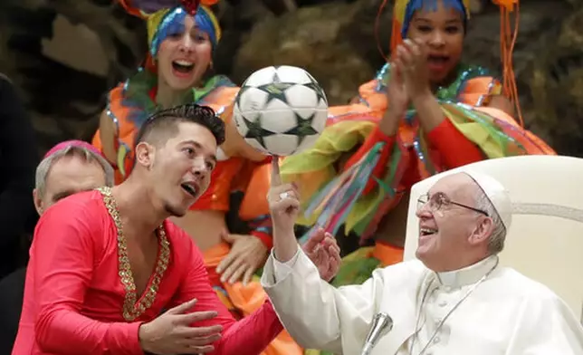 FILE - Pope Francis twirls a soccer ball he was presented by a member of the Circus of Cuba, during his weekly general audience in the Pope Paul VI hall, at the Vatican, Wednesday, Jan. 2, 2019. (AP Photo/Andrew Medichini, file)