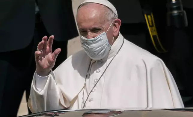 FILE - Pope Francis, wearing a protective face mask to help curb the diffusion of COVID-19, leaves at the end of his weekly open-air general audience in the San Damaso courtyard at the Vatican, Wednesday, June 16, 2021. (AP Photo/Domenico Stinellis, file)