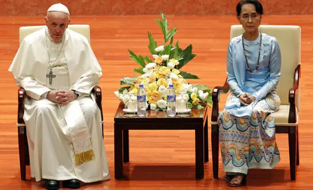 File - Pope Francis and Myanmar's leader Aung San Suu Kyi meet at the International Convention Centre of Naypyitaw, Myanmar, Tuesday, Nov. 28, 2017. (AP Photo/Andrew Medichini, file)