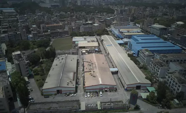 An aerial view of a factory of Kam Pin Industrial (HK) Ltd, manufacturer of coated aluminum panels, in Dongguan city in southern China's Guangdong province on Thursday, April 17, 2025. (AP Photo/Ng Han Guan)