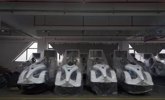 Completed virtual reality gaming platforms are covered up at the factory of Zhuoyuan Tech Co., Ltd in Panyu district of Guangzhou city in southern China's Guangdong province on Wednesday, April 16, 2025. (AP Photo/Ng Han Guan)