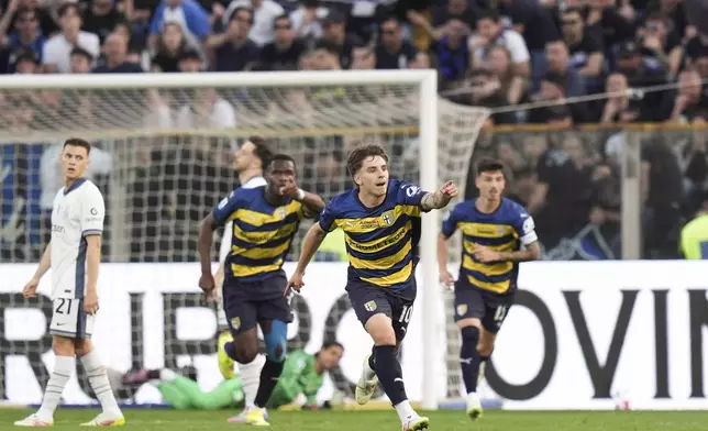 Parma's Adrian Bernabe celebrates after scoring during the Serie A soccer match between Parma and Inter, at the Ennio Tardini Stadium in Parma, Italy, Saturday April 5, 2025. (Massimo Paolone/LaPresse via AP)