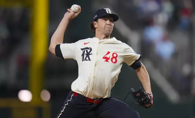 Texas Rangers starting pitcher Jacob deGrom throws a pitch to the Los Angeles Dodgers during the first inning of a baseball game Friday, April 18, 2025, in Arlington, Texas. (AP Photo/Julio Cortez)