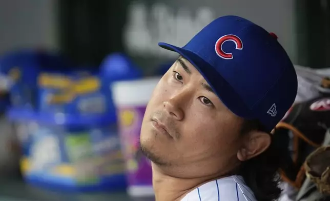 Chicago Cubs starting pitcher Shota Imanaga (18) sits in the dugout during the first inning of a baseball game Friday, April 4, 2025, in Chicago. (AP Photo/Erin Hooley)