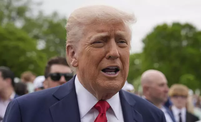 President Donald Trump speaks to reporters during the White House Easter Egg Roll on the South Lawn of the White House, Monday, April 21, 2025, in Washington. (AP Photo/Alex Brandon)