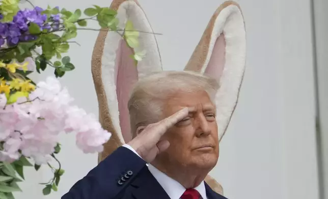 President Donald Trump arrives on the Blue Room Balcony to participate in the White House Easter Egg Roll Monday, April 21, 2025, in Washington. (AP Photo/Alex Brandon)