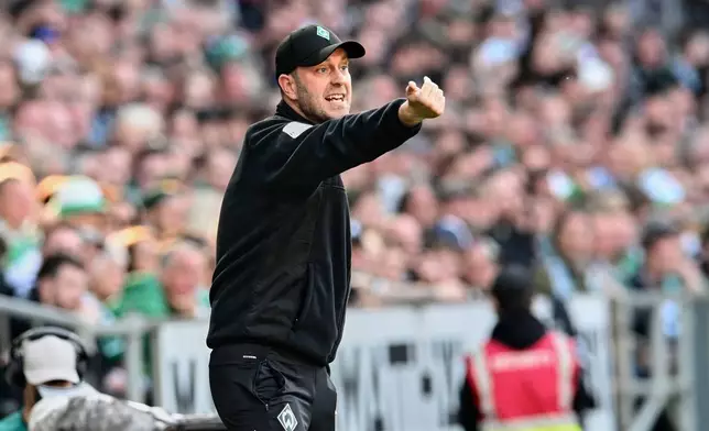 Werder's head coach Ole Werner gestures during the German Bundesliga soccer match between Werder Bremen and FC St. Pauli in Bremen, Germany, Sunday, April 27, 2025. (Carmen Jaspersen/dpa via AP)
