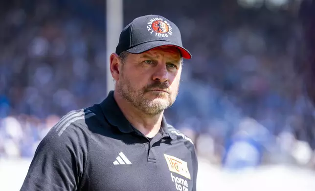 Berlin's head coach Steffen Baumgart arrives for the German Bundesliga soccer match between VfL Bochum and 1. FC Union Berlin in Bochum, Germany, Sunday, April 27, 2025. (David Inderlied/dpa via AP)