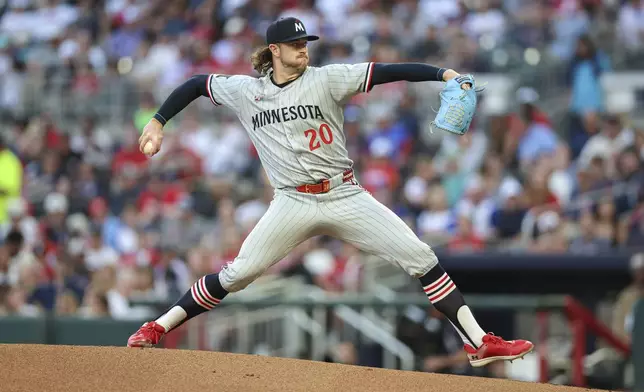 Minnesota Twins pitcher Chris Paddack (20) delivers in the first inning of a baseball game against the Atlanta Braves, Friday, April 18, 2025, in Atlanta. (AP Photo/Colin Hubbard)