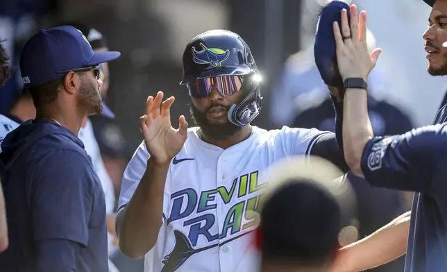 Tampa Bay Rays' Junior Caminero celebrates after scoring against the New York Yankees during the fourth inning of a baseball game Saturday, April 19, 2025, in Tampa, Fla. (AP Photo/Mike Carlson)