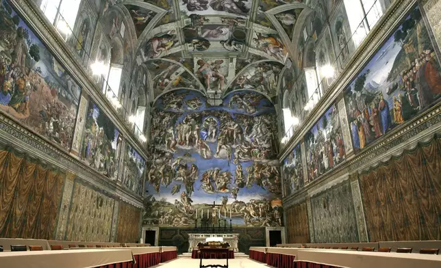 FILE - Tables and chairs line the Sistine Chapel at the Vatican in preparation for the conclave, on April 16, 2005. (AP Photo/Pier Paolo Cito, File)