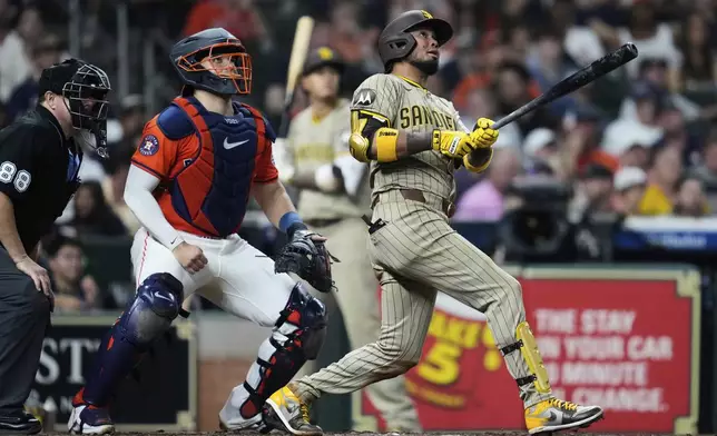 San Diego Padres' Luis Arraez watches his home run hit during the seventh inning of a baseball game against the Houston Astros in Houston, Friday, April 18, 2025. (AP Photo/Ashley Landis)