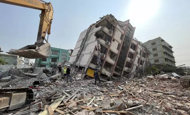 In this photo released by Xinhua News Agency, rescuers carry out search and rescue on the damaged buildings in the aftermath of an earthquake in Mandalay, Myanmar, Monday, March 31, 2025. (Jiang Chao/Xinhua via AP)