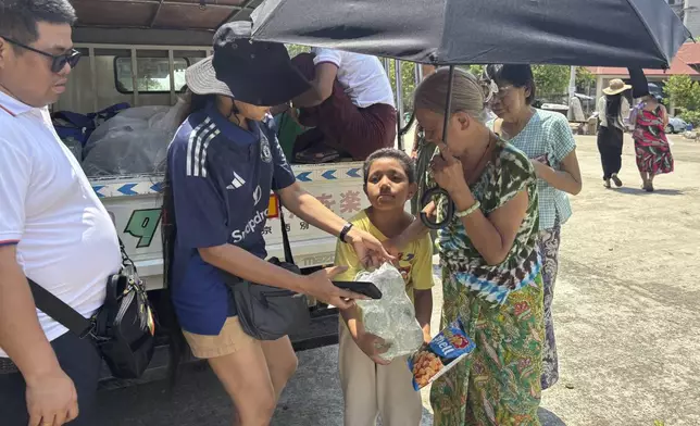 Local volunteers donate food people whose houses were damaged by Friday's earthquake in Naypyitaw, Myanmar, Wednesday, April 2, 2025. (AP Photo)