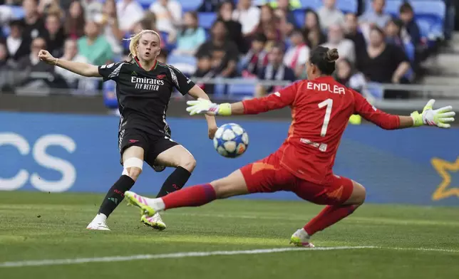 Arsenal's Alessia Russo scores her side's third goal during the women's Champions League semifinals, second leg, soccer match between Olympique Lyonnais and Arsenal at OL Stadium in Decines, outside Lyon, France, Sunday, April 27, 2025. (AP Photo/Thibault Camus)