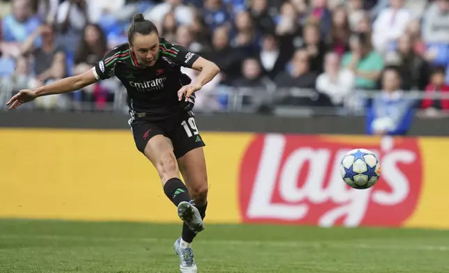 Arsenal's Caitlin Foord scores her side's fourth goal during the women's Champions League semifinals, second leg, soccer match between Olympique Lyonnais and Arsenal at OL Stadium in Decines, outside Lyon, France, Sunday, April 27, 2025. (AP Photo/Thibault Camus)