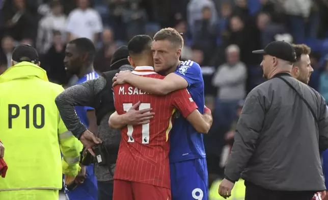Leicester's Jamie Vardy hugs with Liverpool's Mohamed Salah at the end of the English Premier League soccer match between Leicester City and Liverpool at King Power stadium in Leicester, England, Sunday, April 20, 2025. (AP Photo/Rui Vieira)