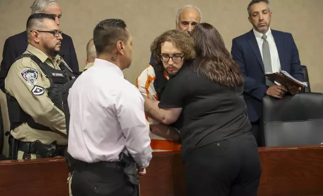 Adriana Zandri, widow of Ivan Manzano killed during the Walmart mass shooting, hugs defendant Patrick Crusius during a plea hearing in El Paso, Texas, Tuesday, April 22, 2025. (Ruben R. Ramirez/Pool Photo via AP)