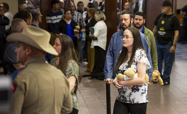 Families embrace as they leave the 409th District Court after Patrick Crusius pleaded guilty in the death of 23 people in the Aug. 3. 2019 Walmart Mass shooting, Monday, April 21, 2025, in El Paso, Texas. (AP Photo/Ivan Pierre Aguirre)