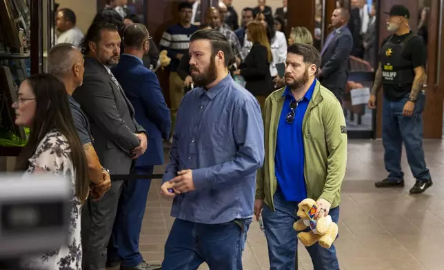 Families embrace as they leave the 409th District Court after Patrick Crusius pleaded guilty in the death of 23 people in the Aug. 3. 2019 Walmart Mass shooting, Monday, April 21, 2025, in El Paso, Texas. (AP Photo/Ivan Pierre Aguirre)