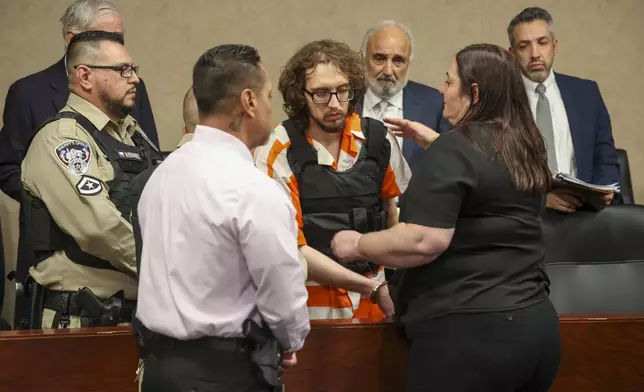 Adriana Zandri, widow of Ivan Manzano killed during the Walmart mass shooting, hugs defendant Patrick Crusius during a plea hearing in El Paso, Texas, Tuesday, Tuesday, April 22, 2025. (Ruben R. Ramirez/Pool Photo via AP)