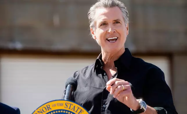 California Gov. Gavin Newsom discusses President Donald Trump's tariffs during a press conference on Wednesday, April 16, 2025, at an almond farm in Ceres, Calif. (AP Photo/Noah Berger)