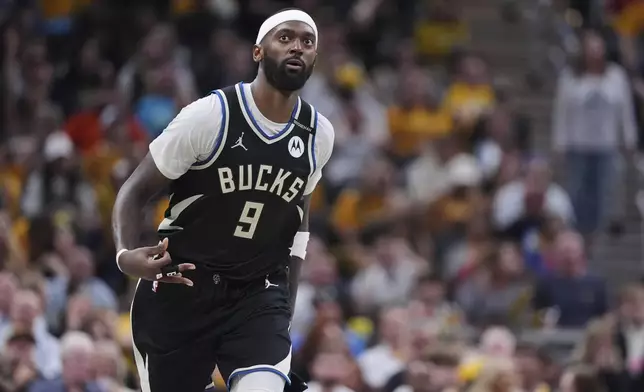 Milwaukee Bucks forward Bobby Portis (9) gestures after a basket during the second half of a first-round NBA basketball playoff game in Indianapolis, Tuesday, April 22, 2025. (AP Photo/Michael Conroy)