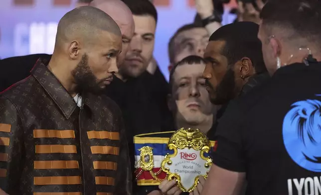 Chris Eubank Jr, left, and Conor Benn face-off during a press conference at The Tottenham Hotspur Stadium in London, Thursday April 24, 2025, two days ahead of his fight against Chris Eubank Jr. (Bradley Collyer/PA via AP)