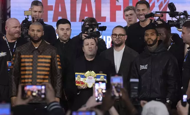 Chris Eubank Jr, left, and Conor Benn pose at the end of a press conference at The Tottenham Hotspur Stadium in London, Thursday April 24, 2025, two days ahead of their combat. (Bradley Collyer/PA via AP)