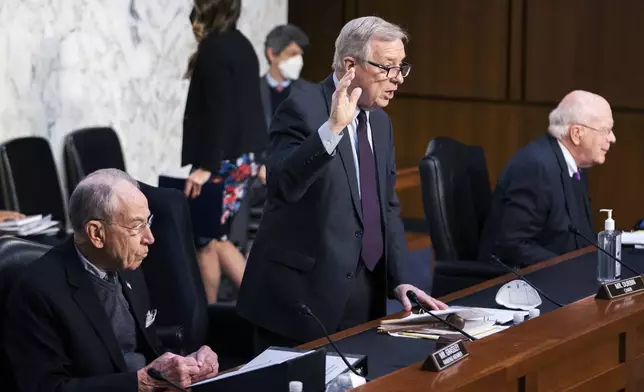 FILE - Senate Judiciary Committee Chairman Sen. Dick Durbin, D-Ill., with ranking member Sen. Chuck Grassley, R-Iowa, left, and Sen. Patrick Leahy, D-Vt., right, swears in Assistant Attorney General for National Security Division Matthew Olsen and Executive Assistant Director, National Security Branch of the FBI Jill Sanborn during the committee hearing to examine the domestic terrorism threat one year after January 6, on Capitol Hill, Feb. 10, 2022, in Washington. (AP Photo/Manuel Balce Ceneta, File)