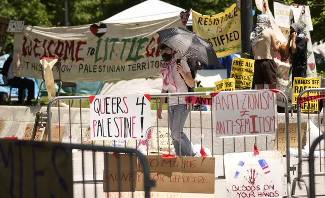 FILE - Tents and pro-Palestinian protesters occupy a quad at Drexel University, in Philadelphia, Tuesday, May 21, 2024. (AP Photo/Matt Rourke, file)